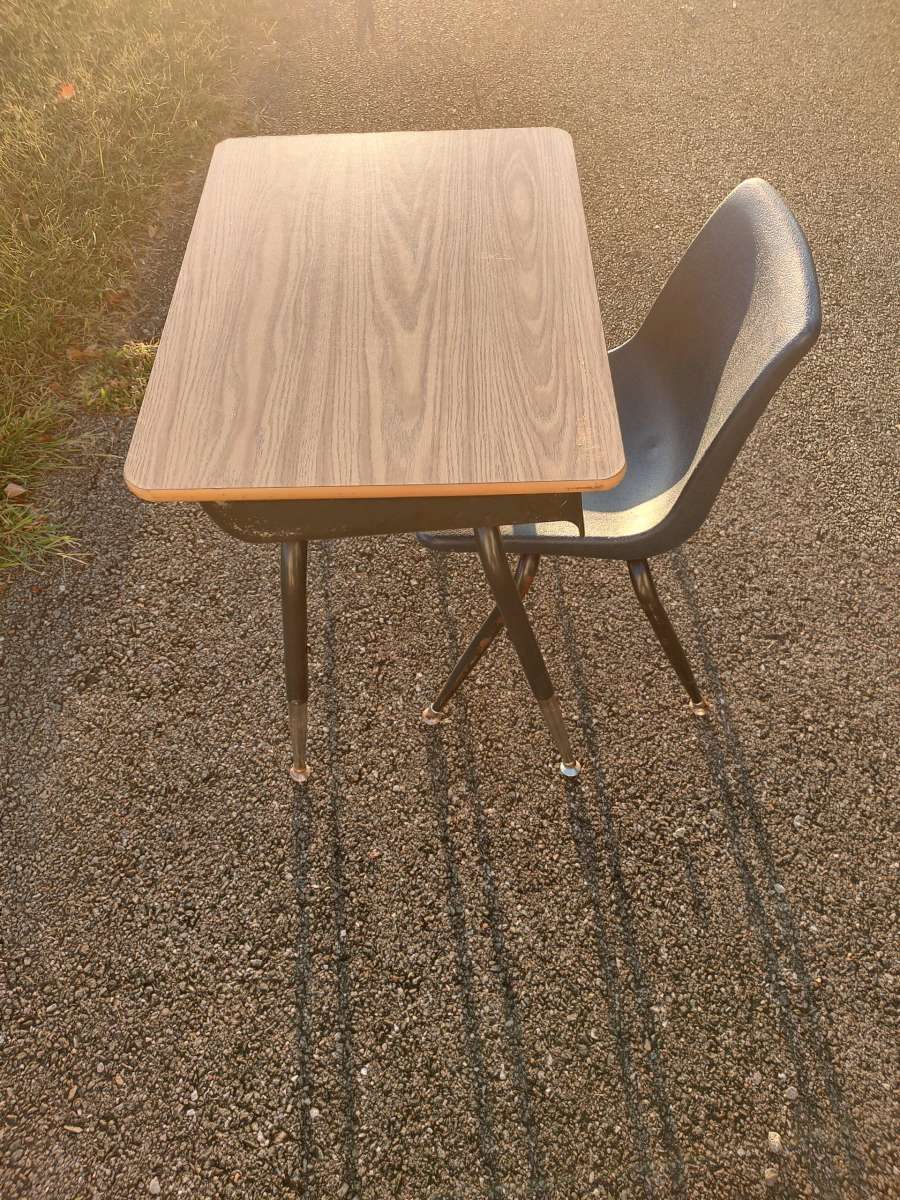 metal desk with a chair or a end table