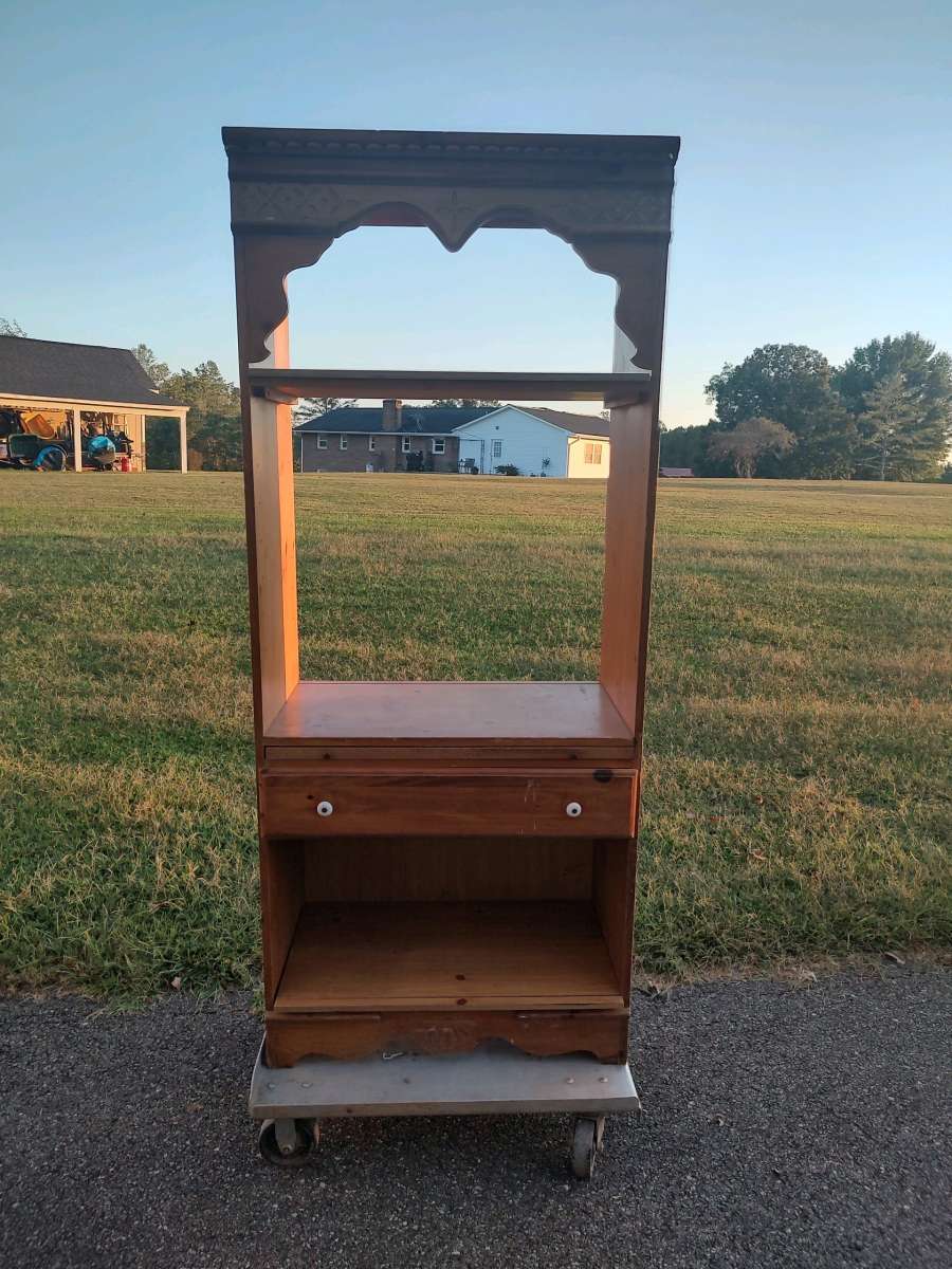 wooden entertainment center with three shelves
