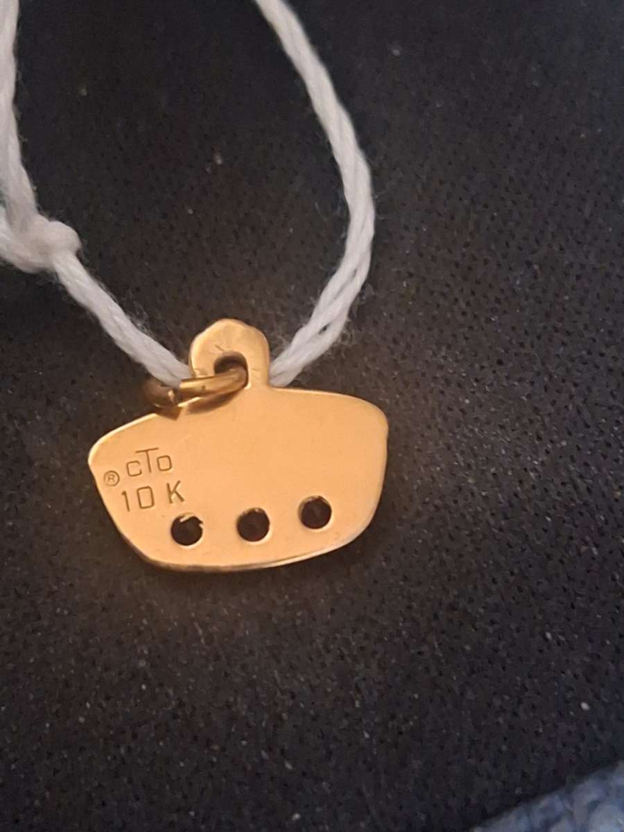 10K pendant  1 point 4 grams
