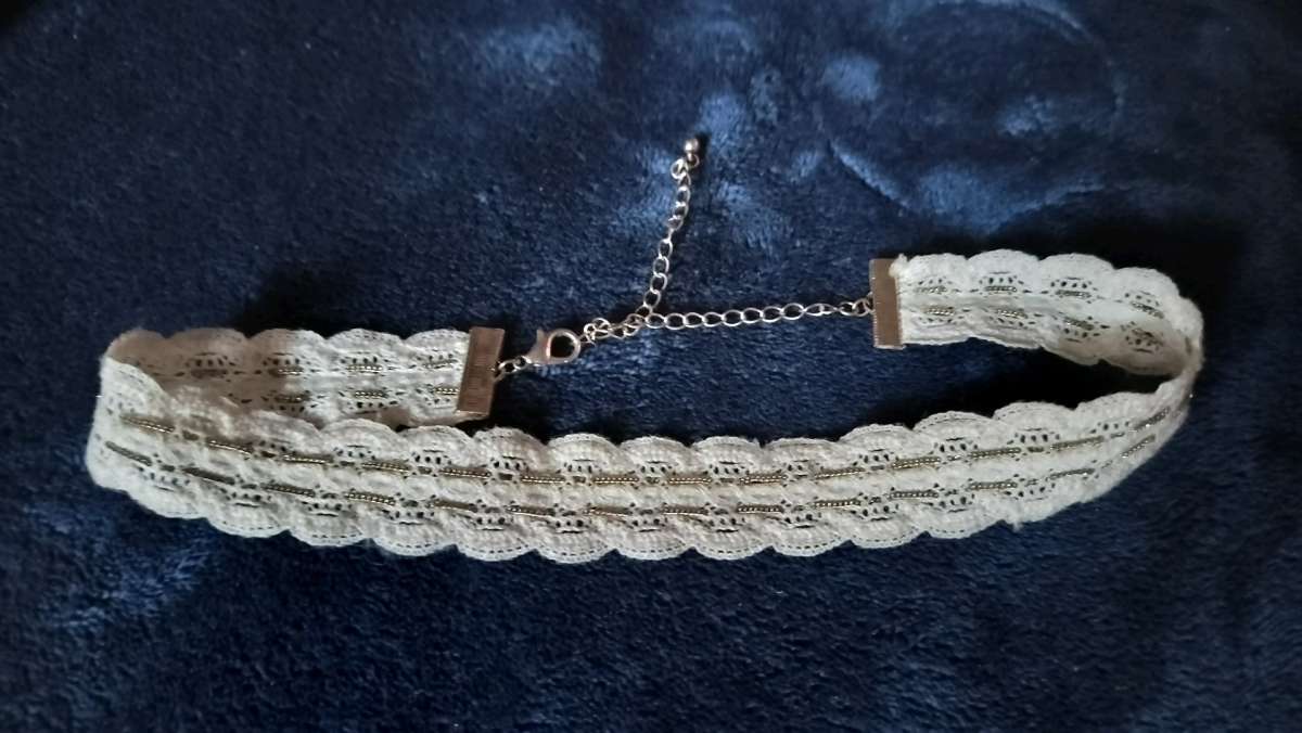 Two choker necklaces and a silver bracelet