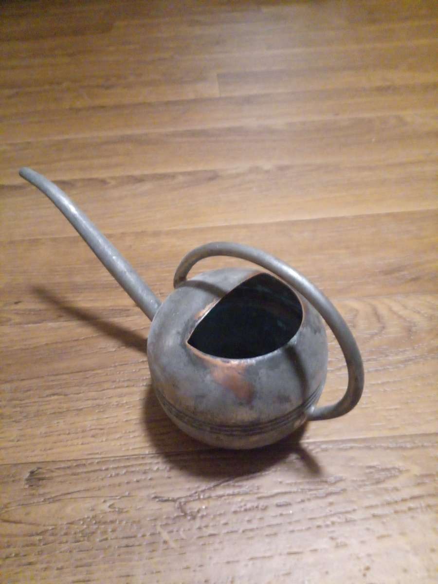 copper watering can