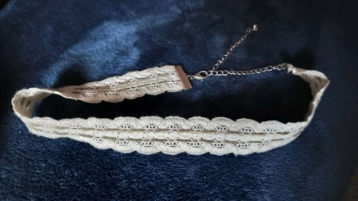 Two choker necklaces and a silver bracelet