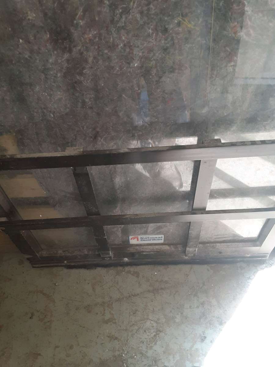 Commercial glass door with hinges but no frame