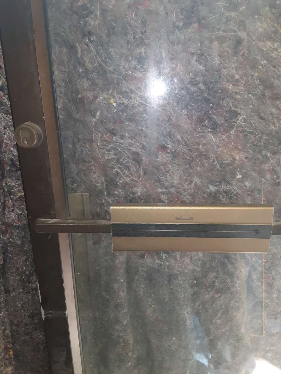 Commercial glass door with hinges but no frame