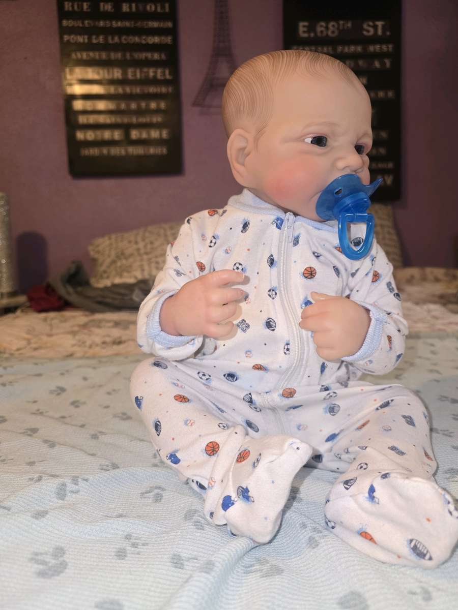 Realistic looking baby boy doll