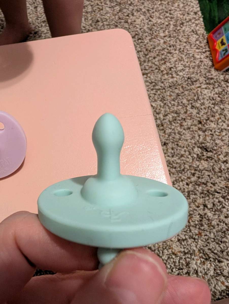 5 Cutie Pat Pacifiers and a teether
