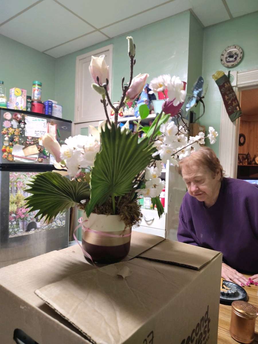 Floral Arrangement Ruffled Fan Palm Leaves Tulips Hydrangea