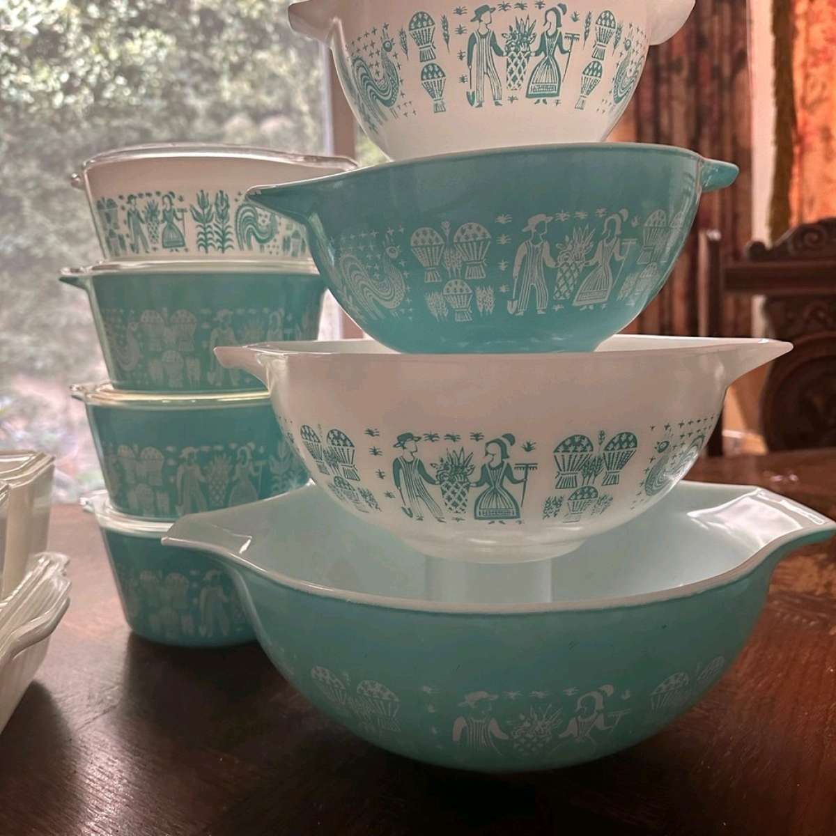two sets of turquoise Pyrex vintage dishes
