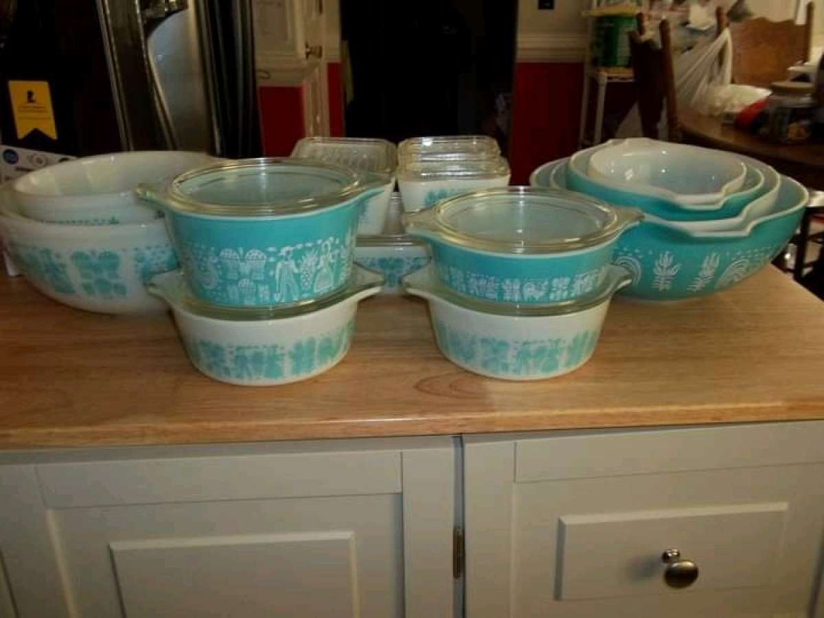 two sets of turquoise Pyrex vintage dishes