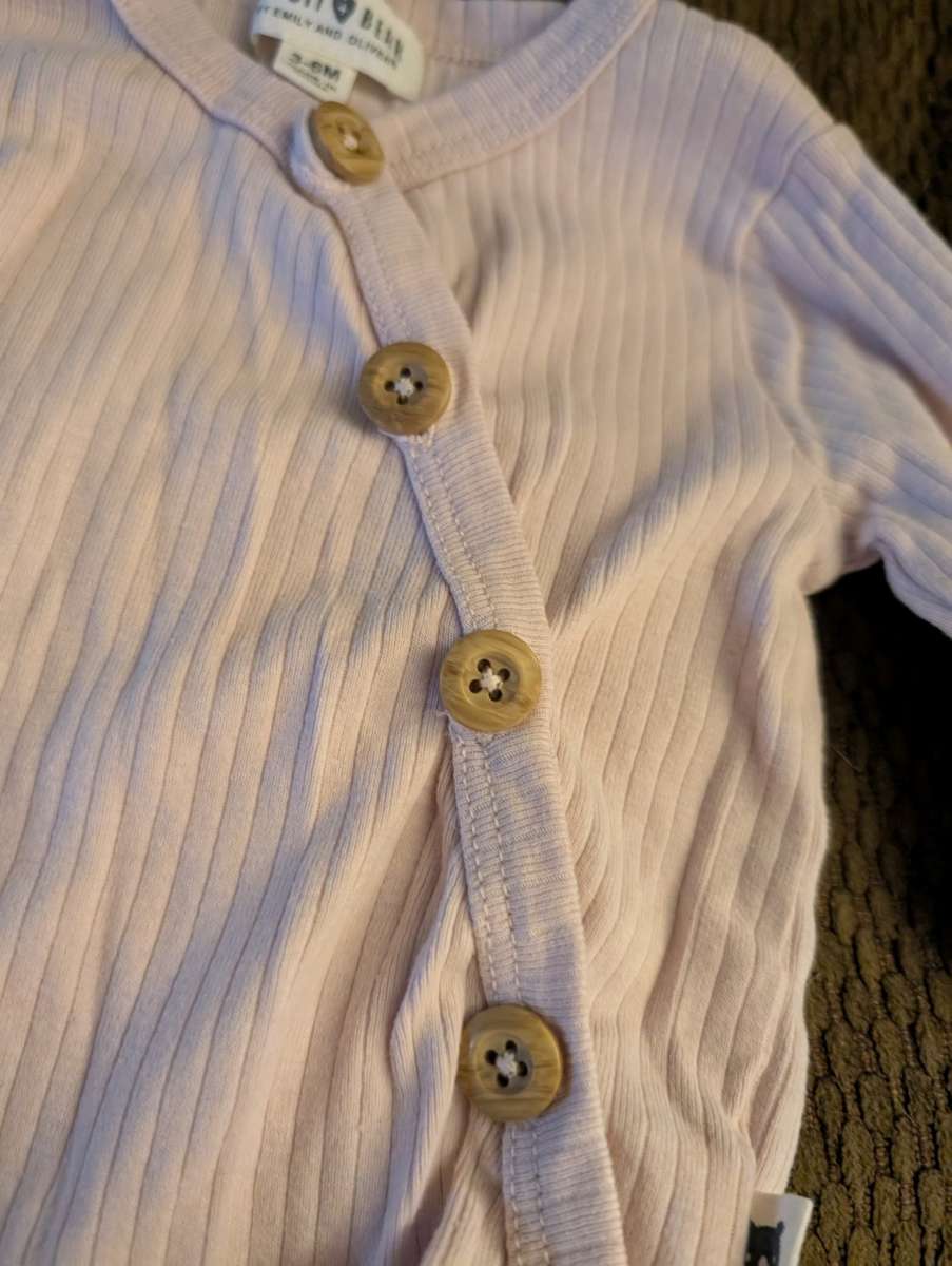 Baby onesie with buttons