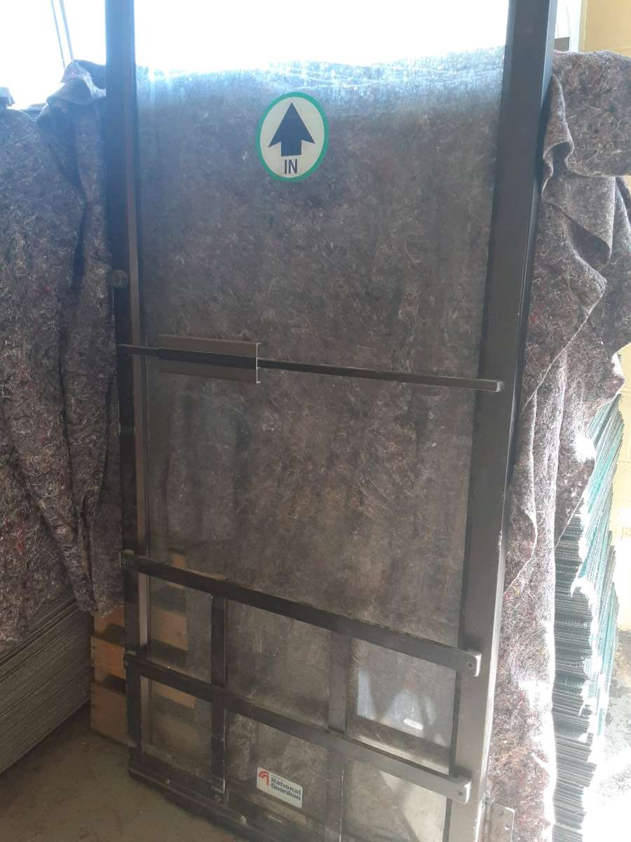 Commercial glass door with hinges but no frame