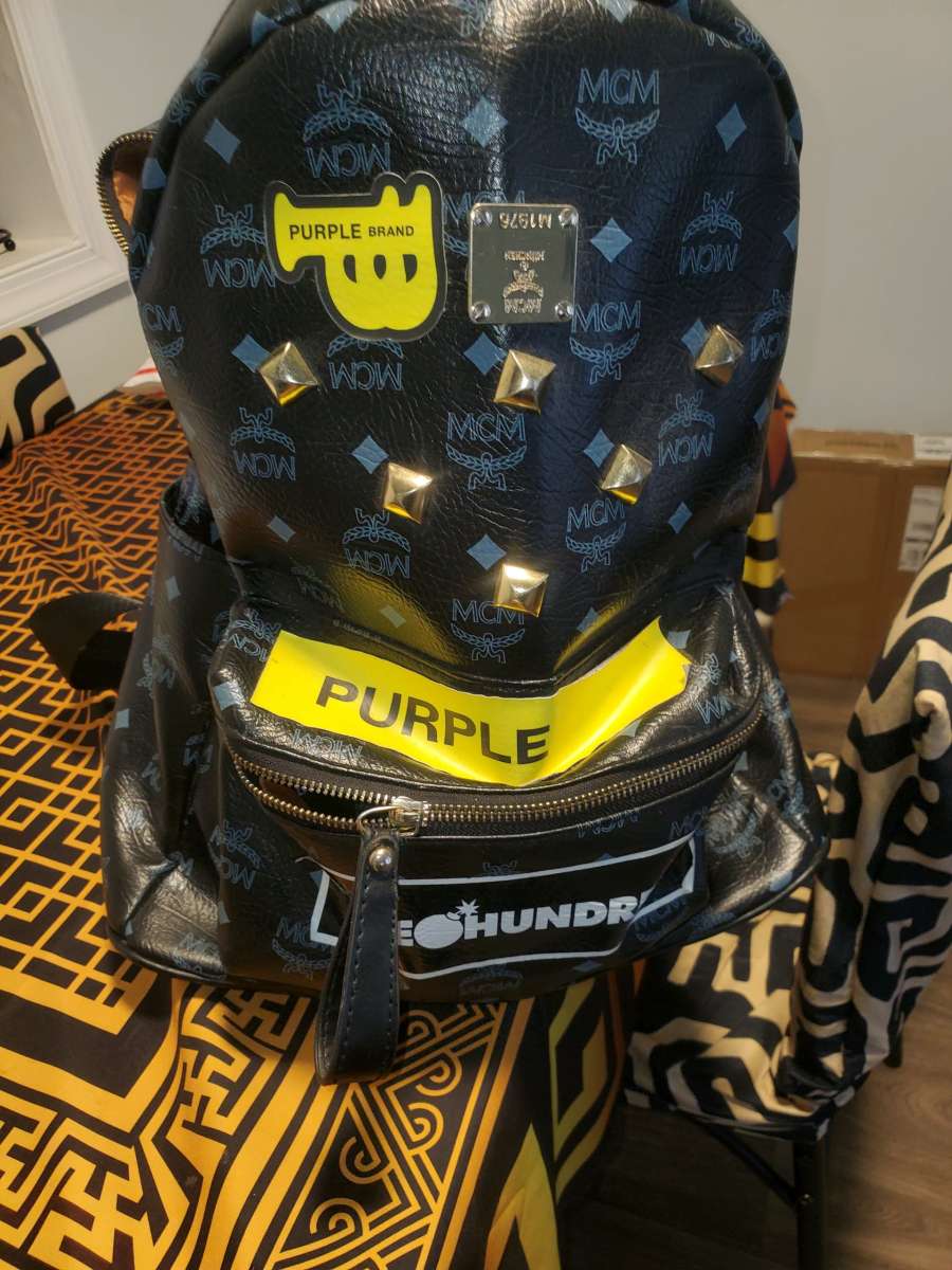 Mcm backpack black and gold