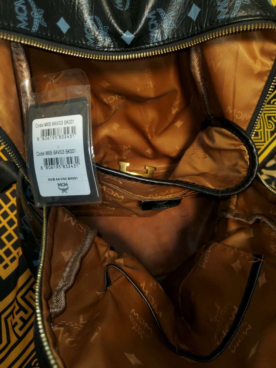 Mcm backpack black and gold