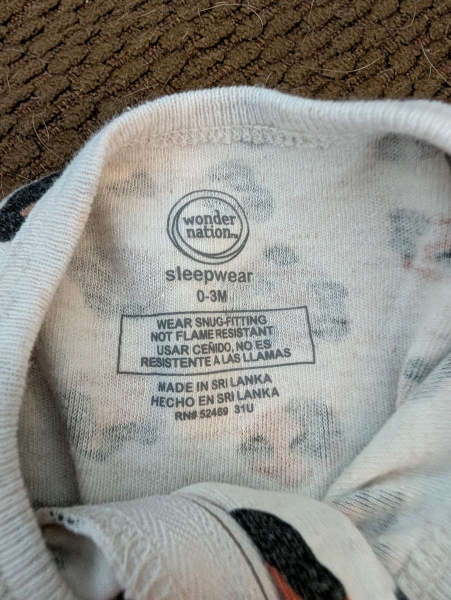 Leopard print baby sleepsuit with feet