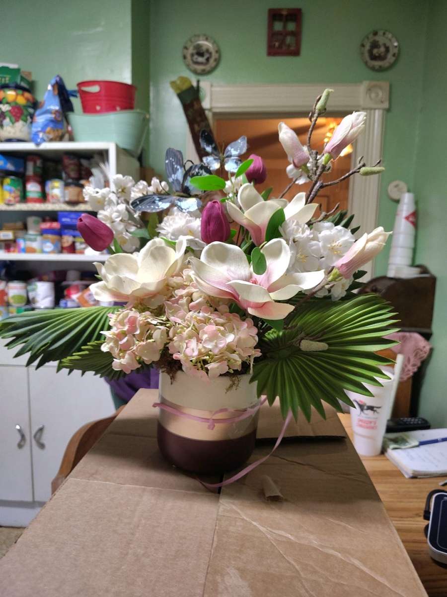 Floral Arrangement Ruffled Fan Palm Leaves Tulips Hydrangea