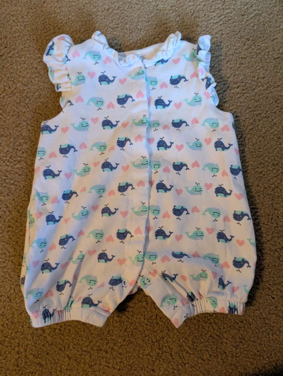 Baby romper with a whale pattern