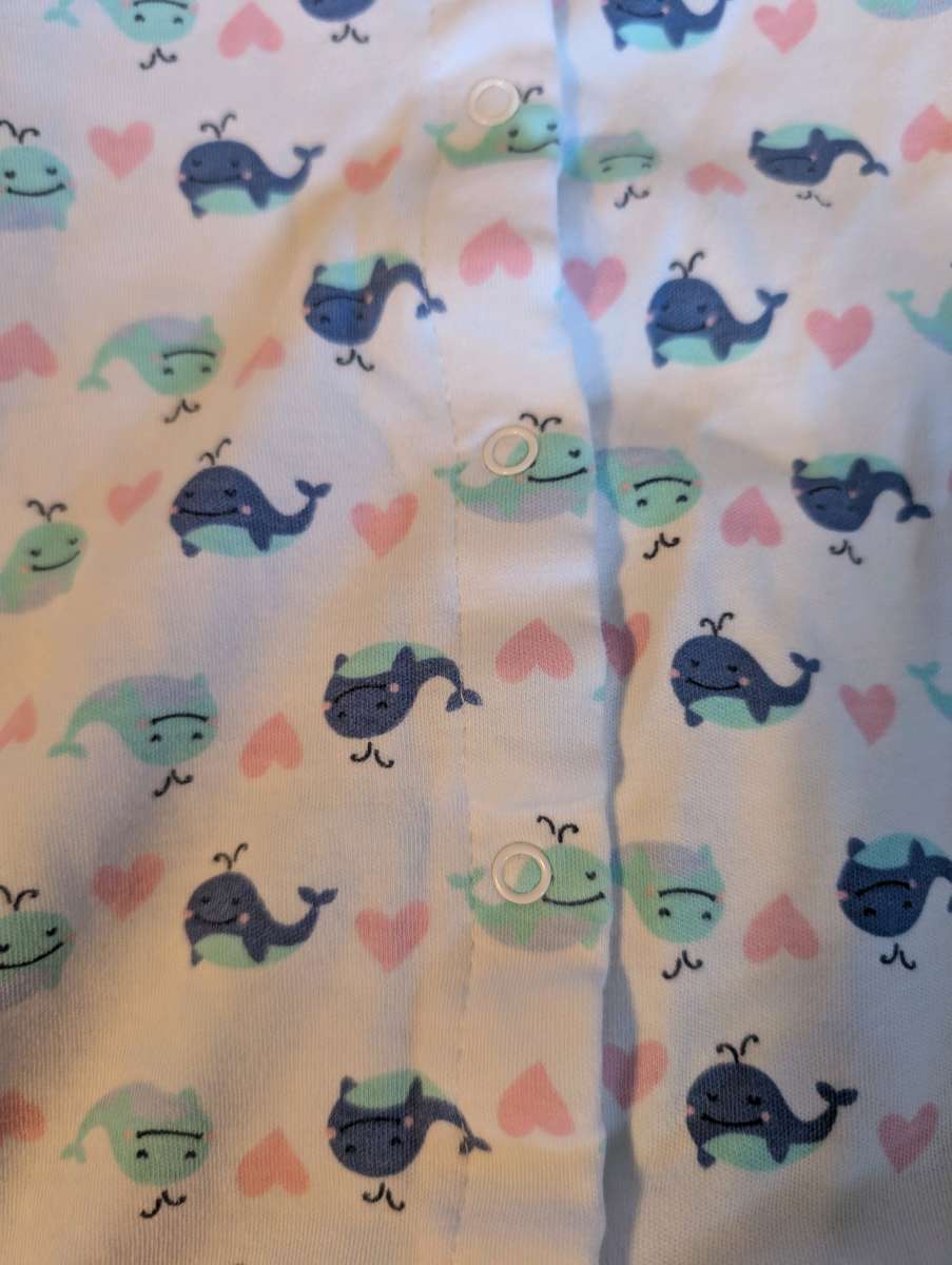 Baby romper with a whale pattern