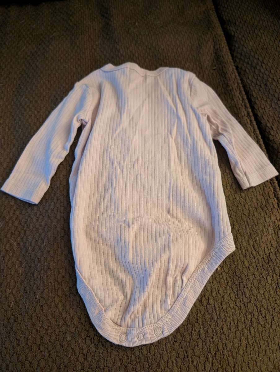 Baby onesie with buttons