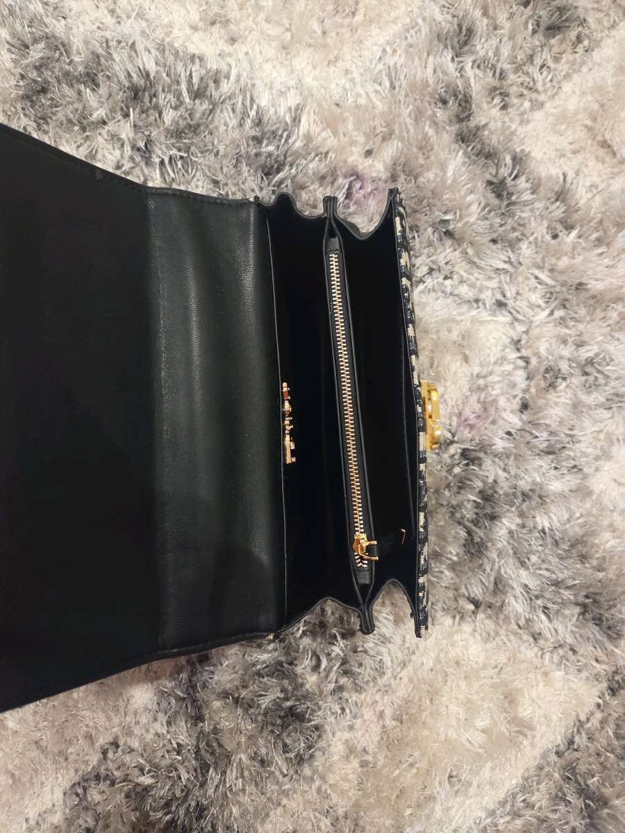 Luxury Monogram Handbag with Gold Accents and Pearl Lock Det