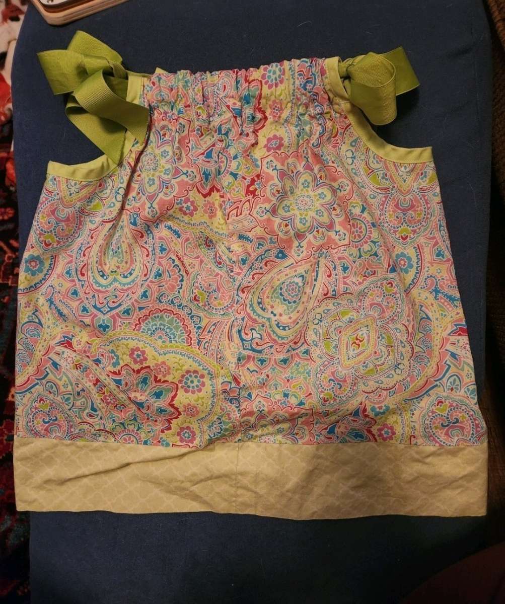 Girl dress with green ribbon straps