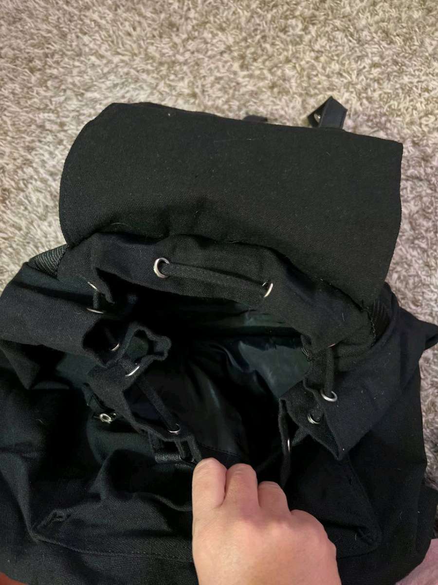 Trendy Black Canvas Backpack with Luxurious Leather Accents