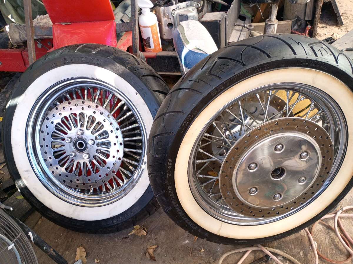 front and rear white wall tires and chrome spoke rims