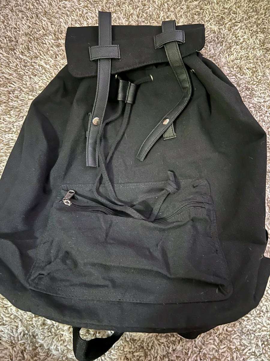 Trendy Black Canvas Backpack with Luxurious Leather Accents