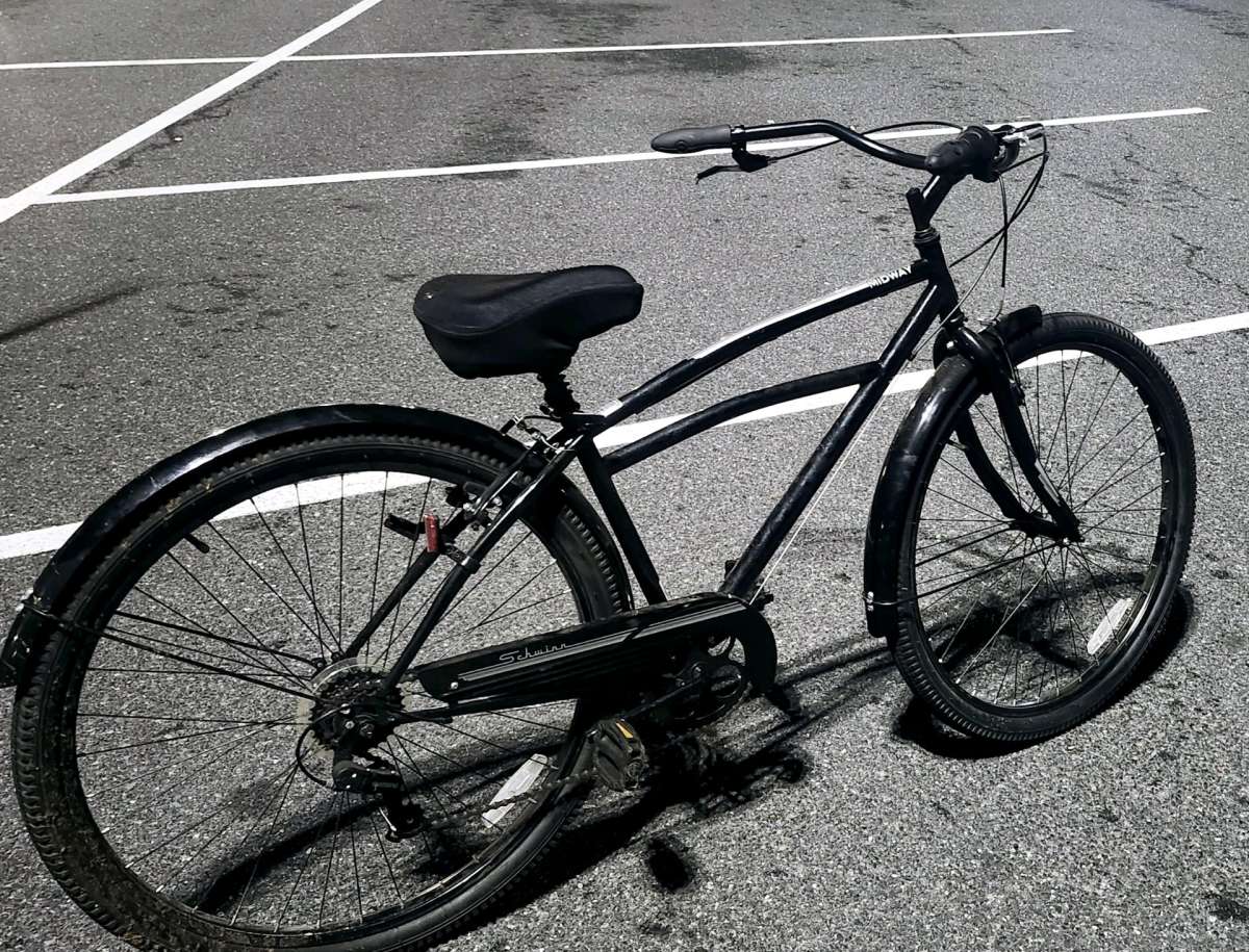 Black Schwinn cruiser bicycle  with carrier
