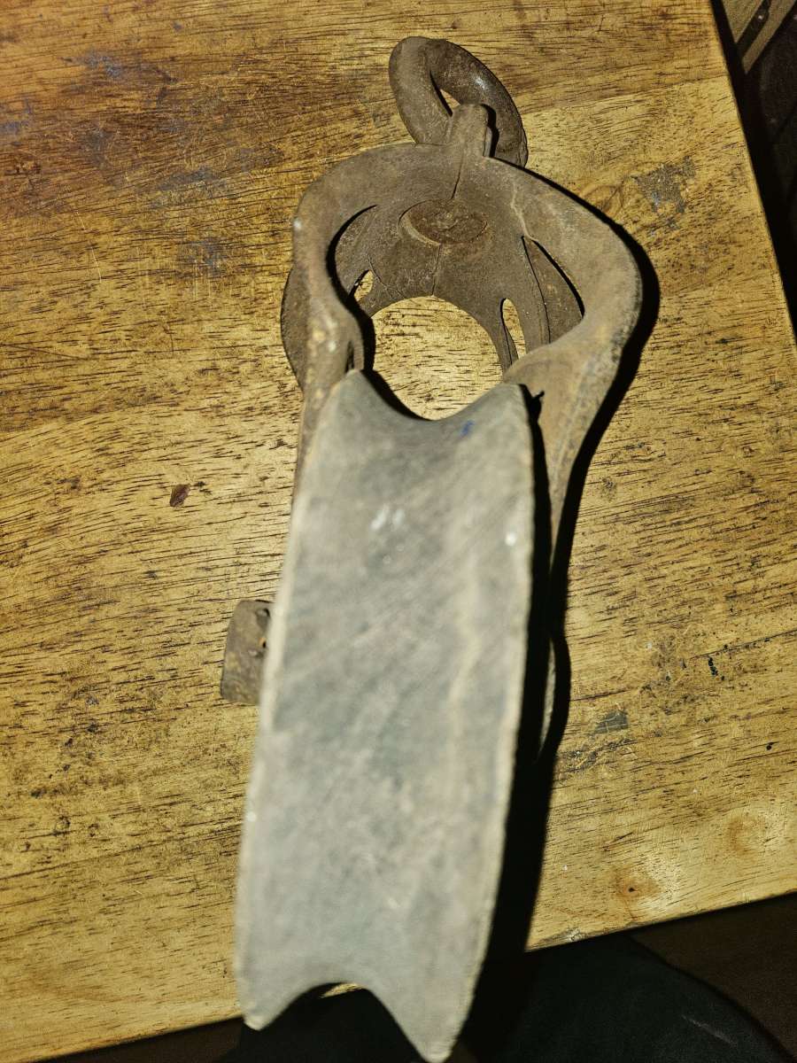 2 old wooden pulleys with metal frames 10 dollars for both