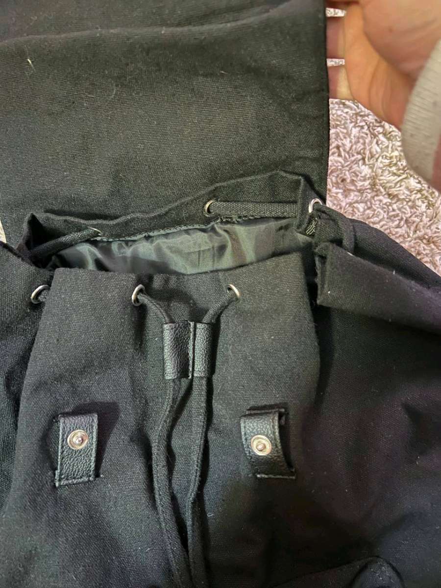 Trendy Black Canvas Backpack with Luxurious Leather Accents