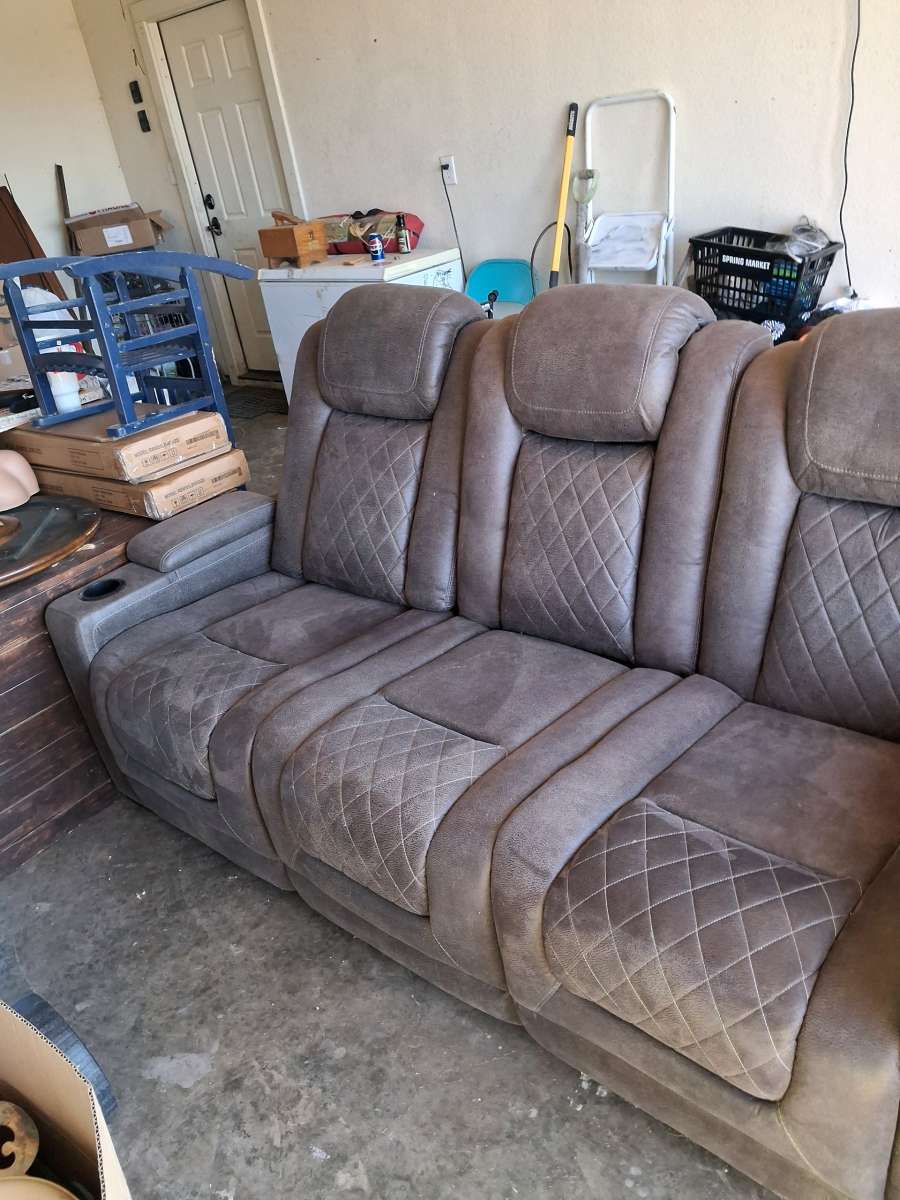 Brown suede couch the middle saint has a not lot in the midd