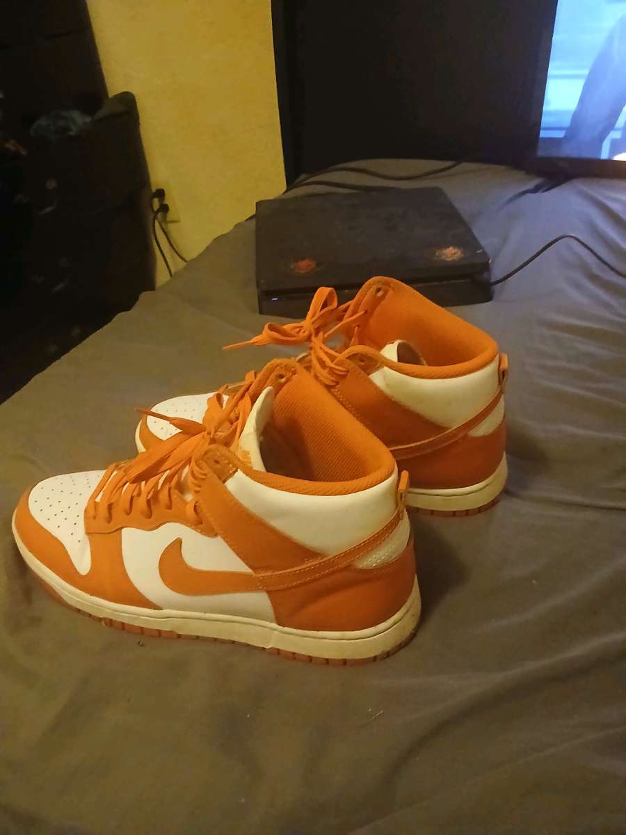 orange and white  Nike  shoes