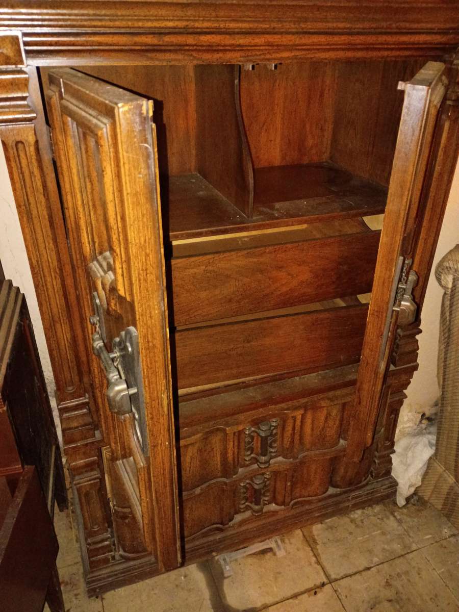 antique wooden cabinet with decorative designs
