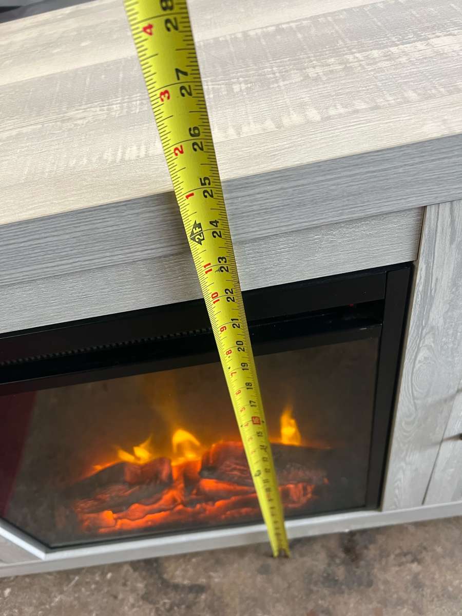 mueble para TV y chimenea en buen estado