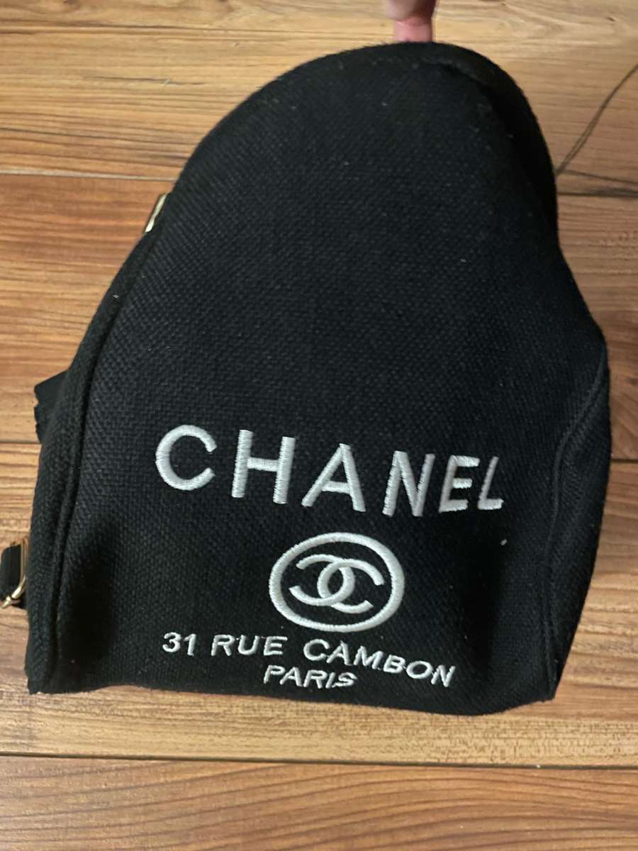 black Chanel bag with a red interior