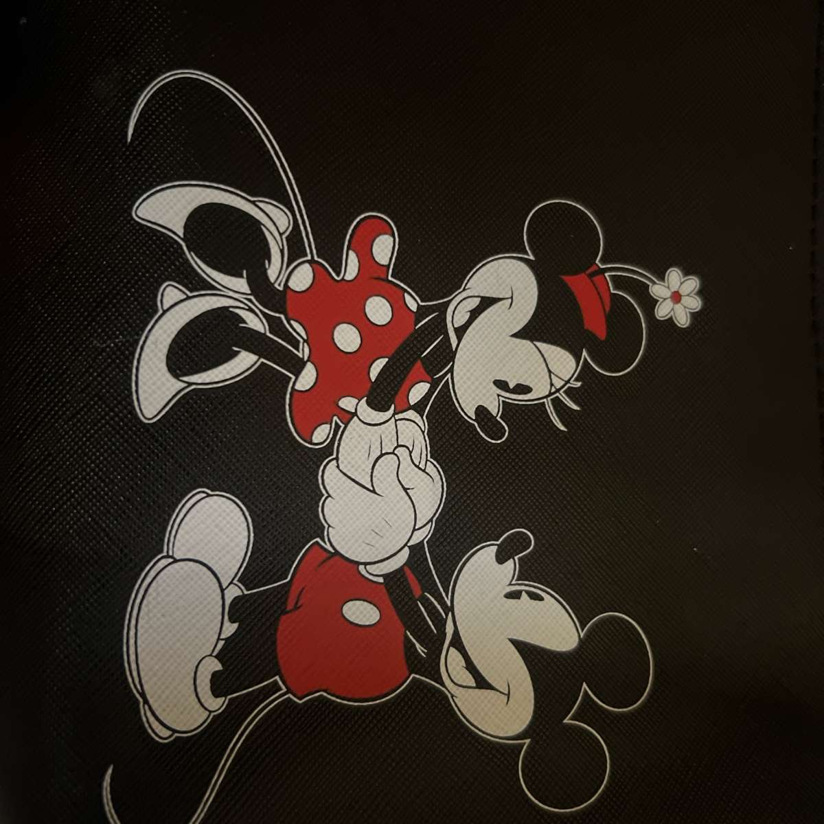 Mickey and Minnie Mouse clutches and a crossbody bag