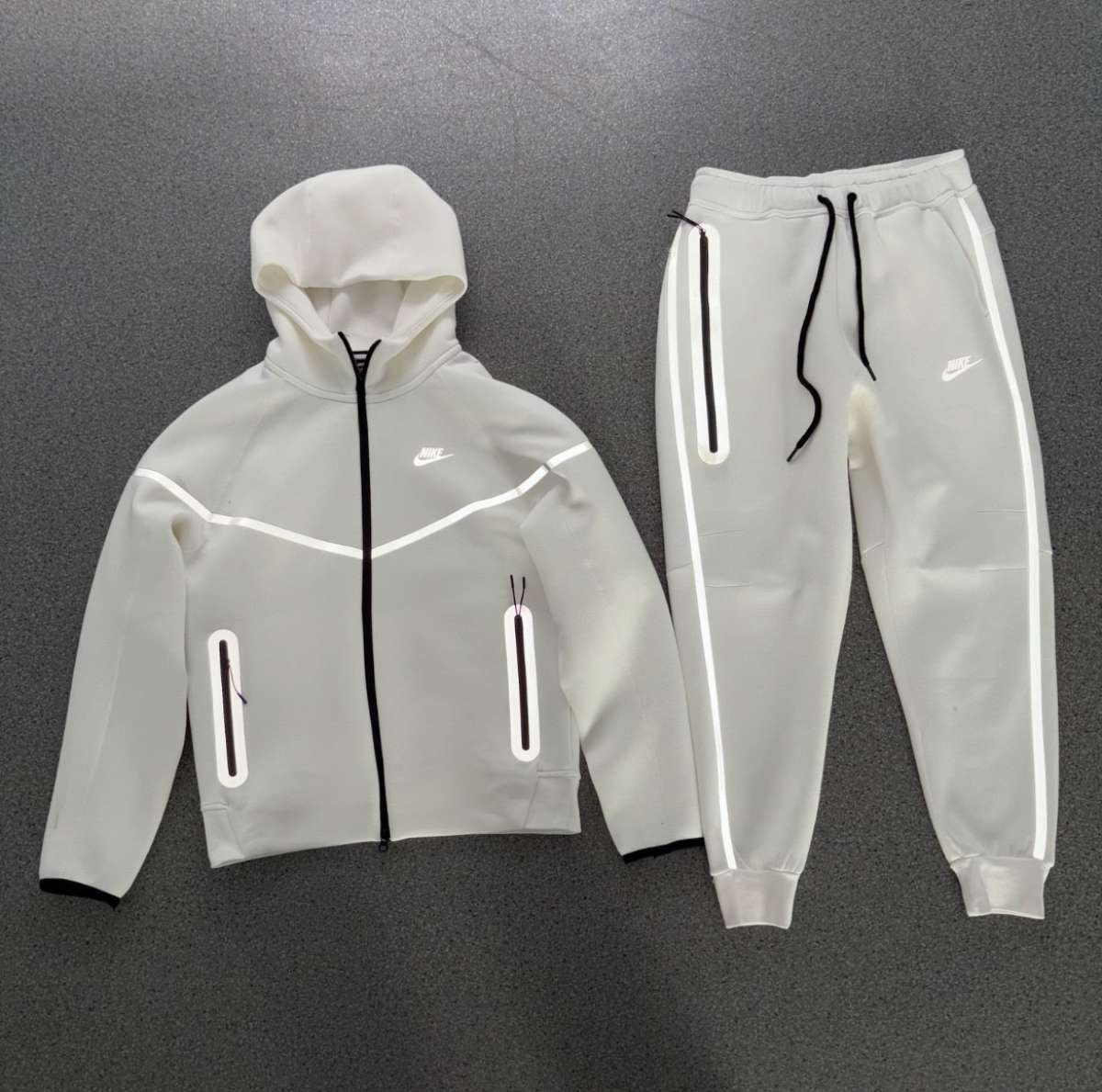 white Nike tech reflective