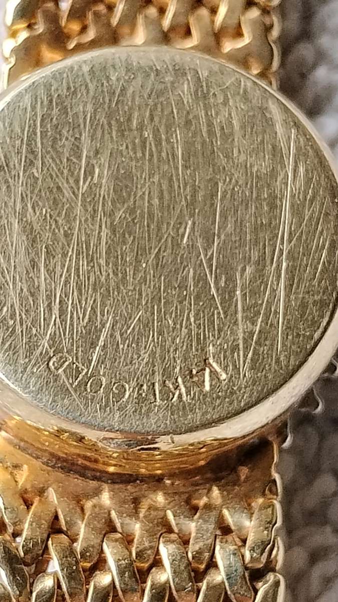 14 karat gold diamond Geneva quartz watch for ladies