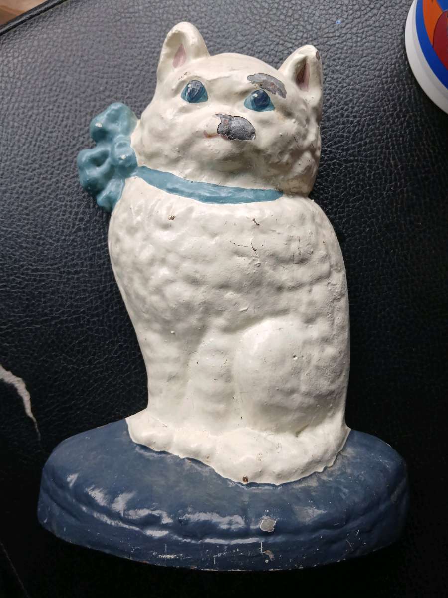 vintage cast iron cat with ribbon