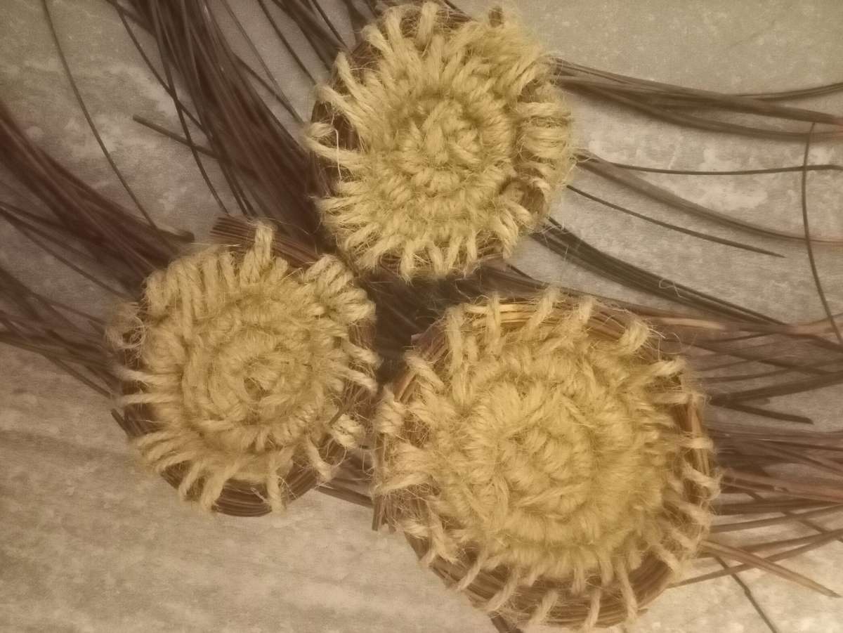 homemade jewelry order made out of pine needles and thread