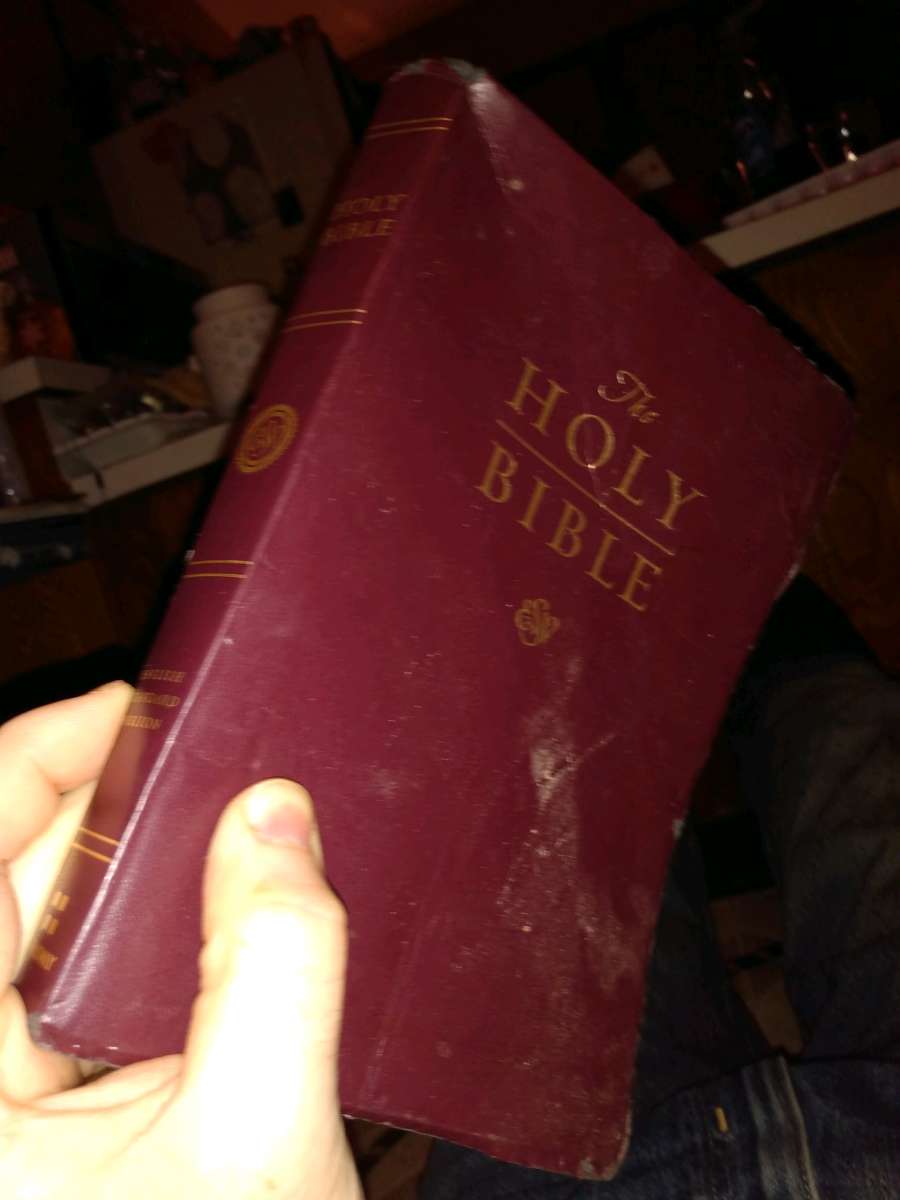 used old standard English Bible with a minor crease
