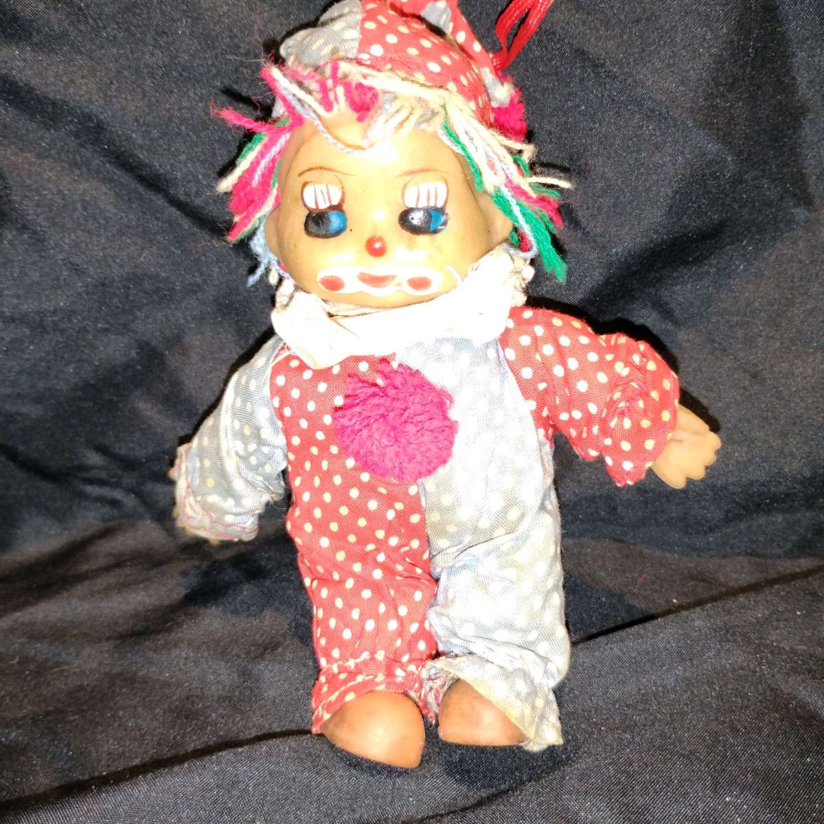 this is a vintage collectible clown doll cloth body vinyl he