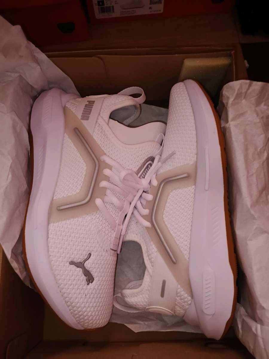 pumas and adidas sneakers