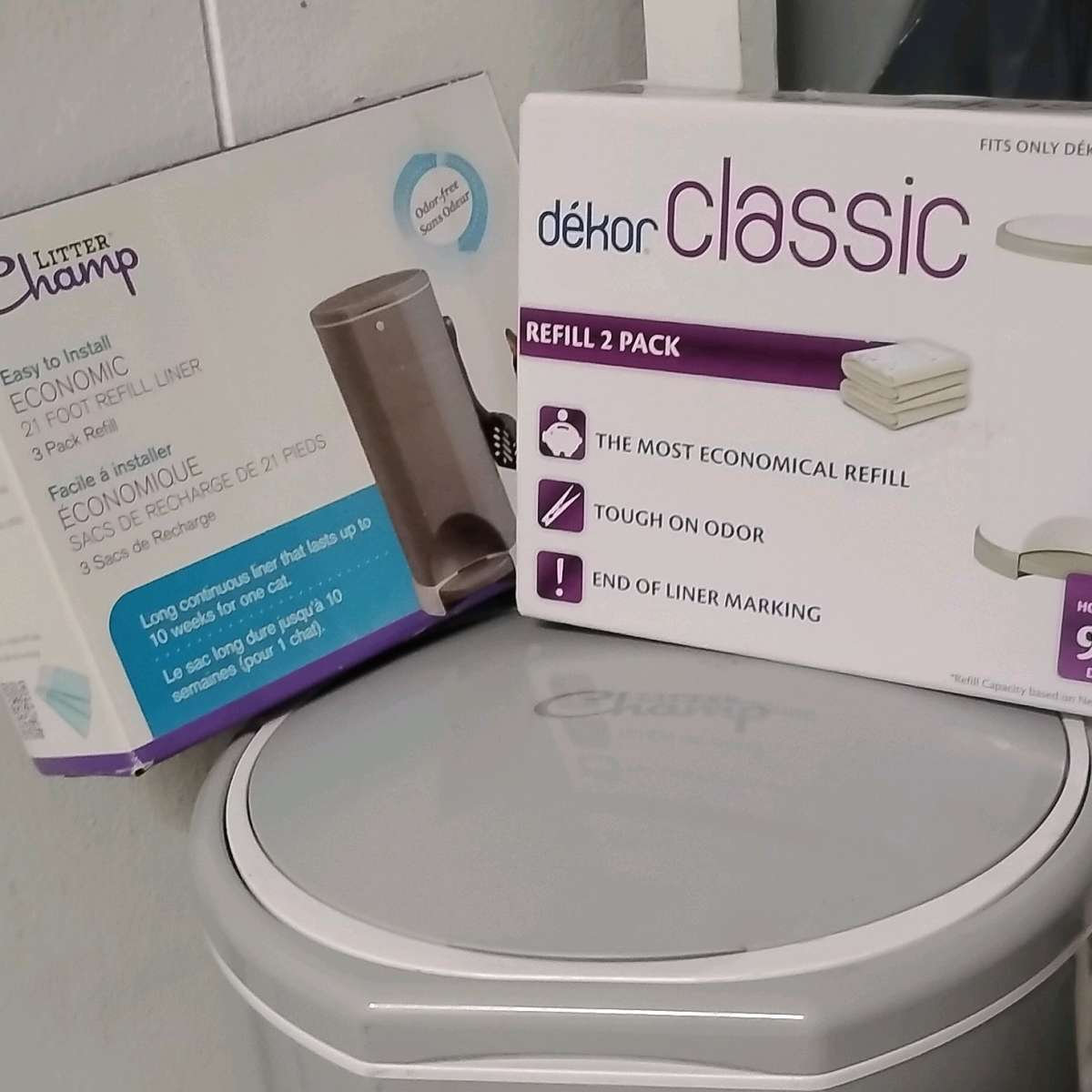 litter champ and 2 boxes of replacement bags