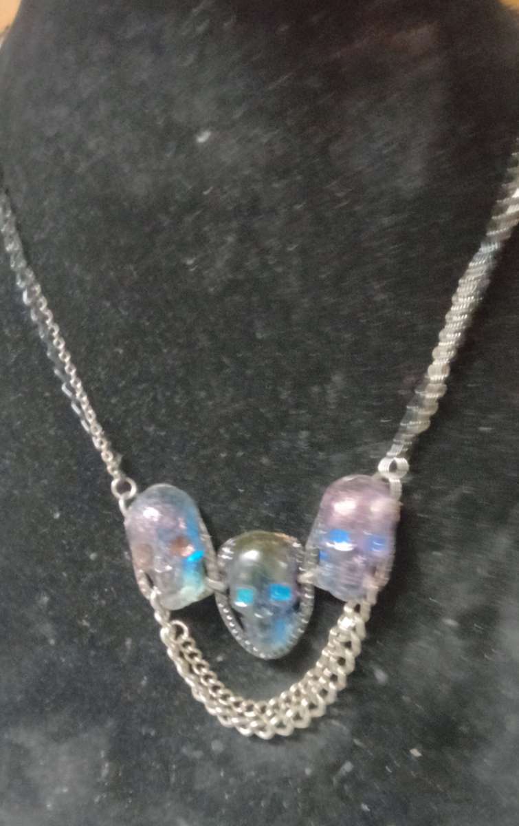 three skulls with multiple chains made with Uv resin