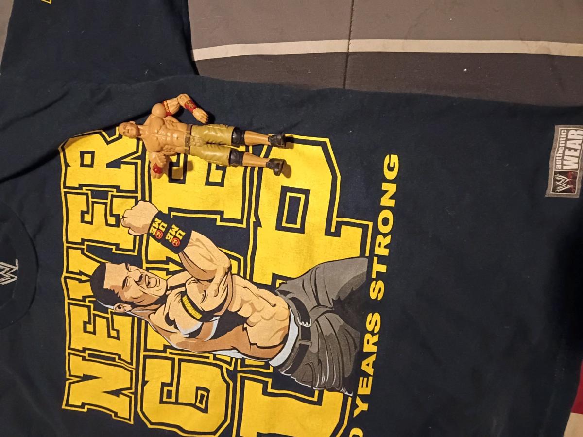 med size shirt with a John Cena figure for sale as a lot