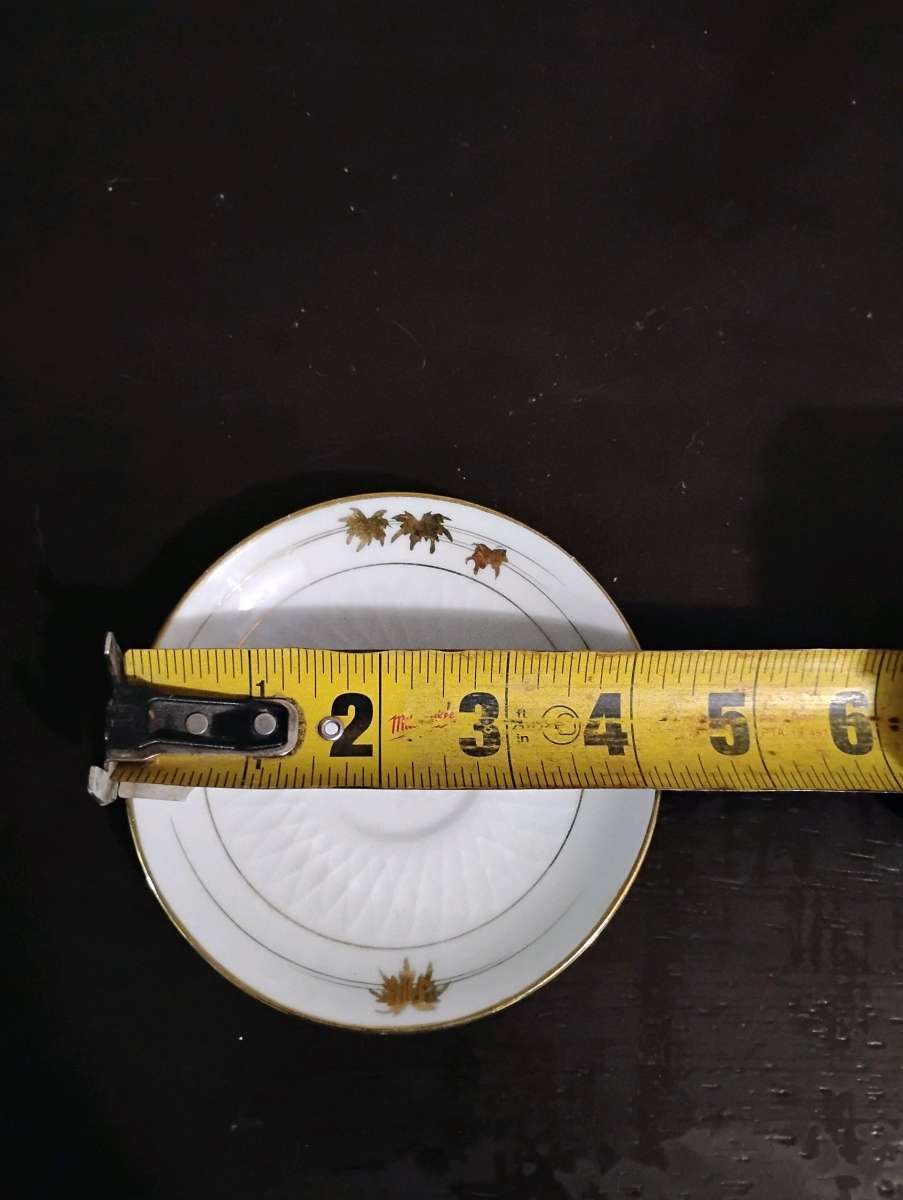 Set of 5 white with gold trim teacup saucers