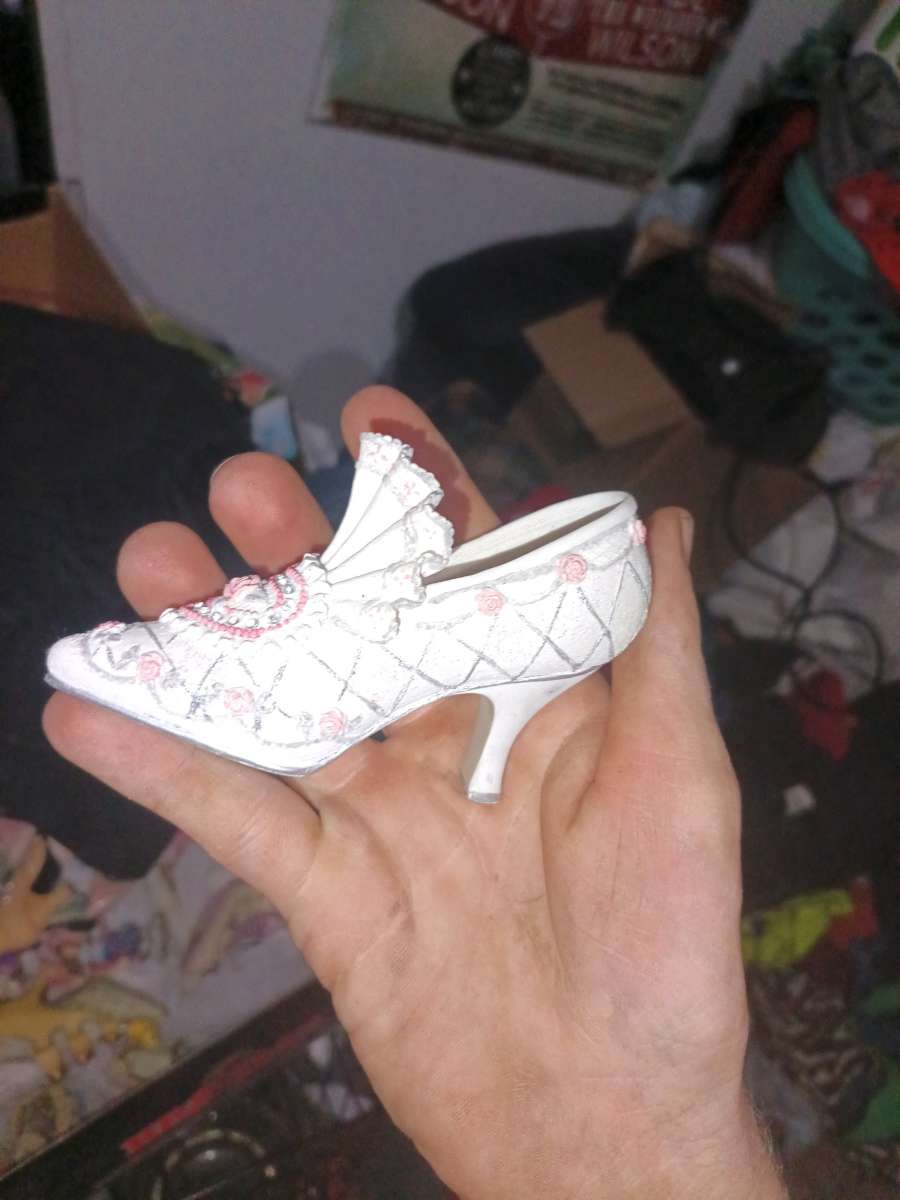 The product is a 35 ceramic Victorian floral shoe collectibl