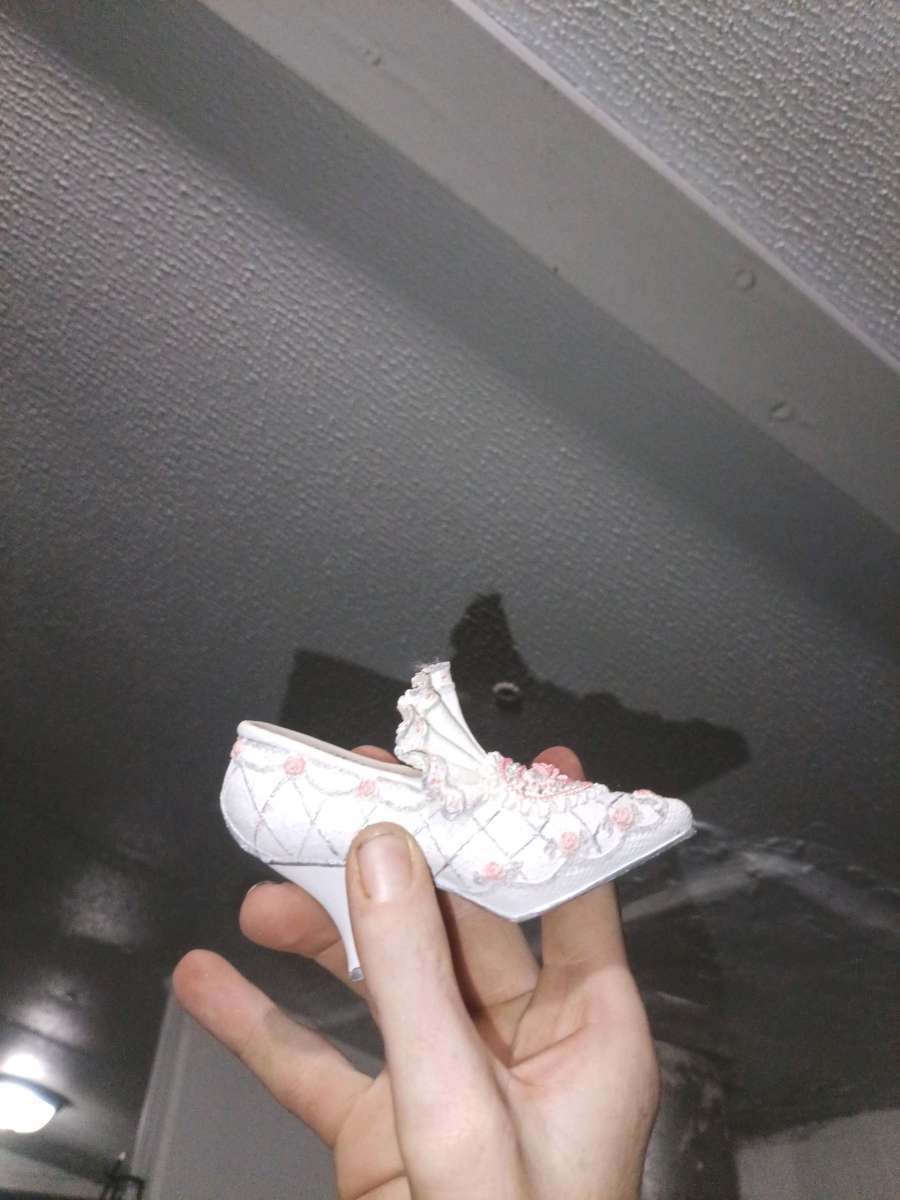 The product is a 35 ceramic Victorian floral shoe collectibl