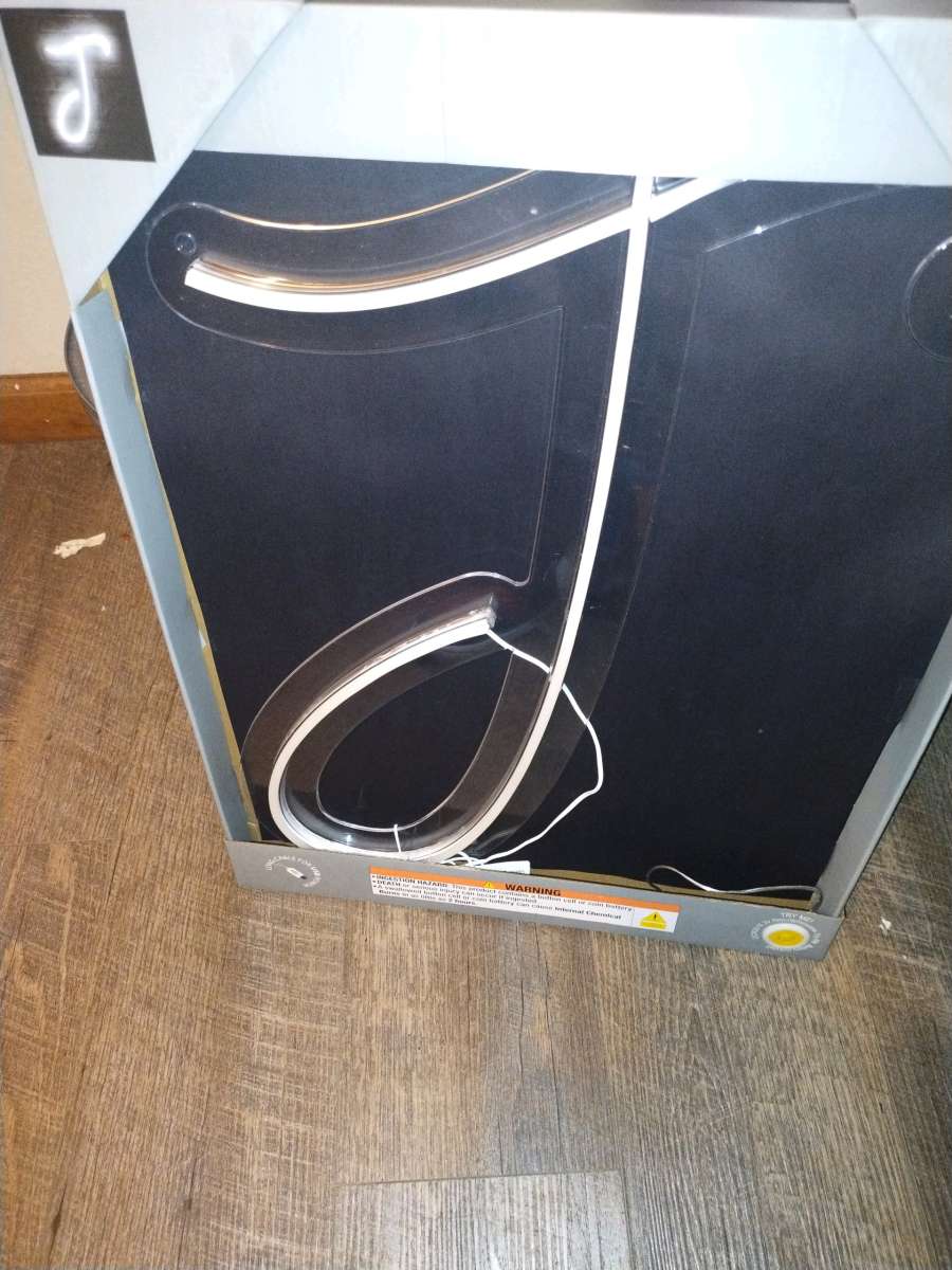 a neon light up j sign  brand new